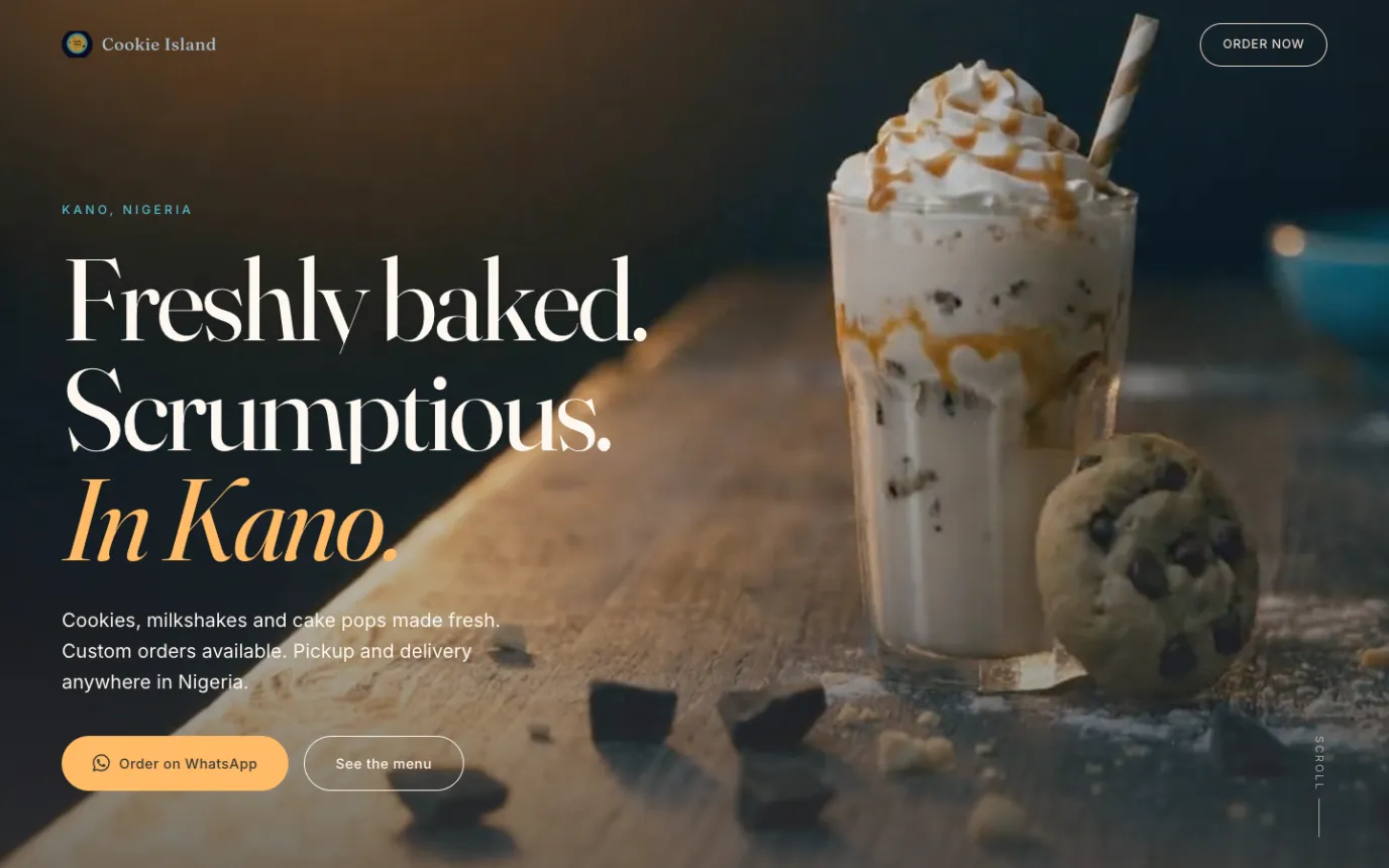 The Cookie Island homepage: the headline Freshly baked, scrumptious, in Kano beside a milkshake and cookies