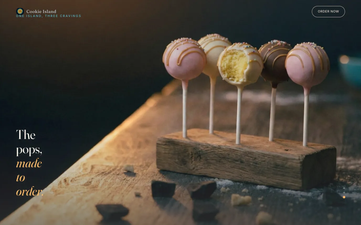 A scroll scene of decorated cake pops on a wooden stand with the words The pops, made to order